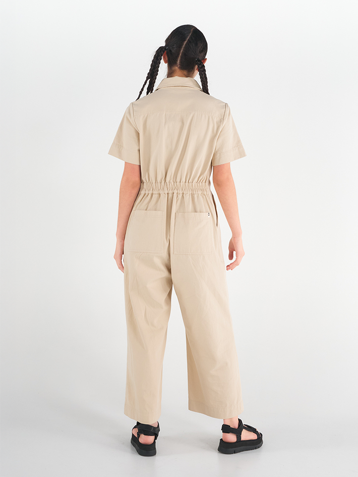 Back view of Stella Jumpsuit in Oatmilk beige cotton, relaxed fit, Madge Goods Sydney.