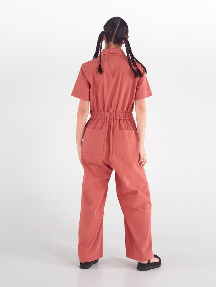 Back view of Stella Jumpsuit in Terracotta Red cotton, relaxed fit, Sydney design.